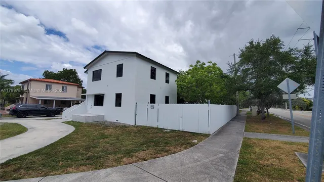 a front view of a house with yard