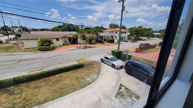 a view of a balcony with yard