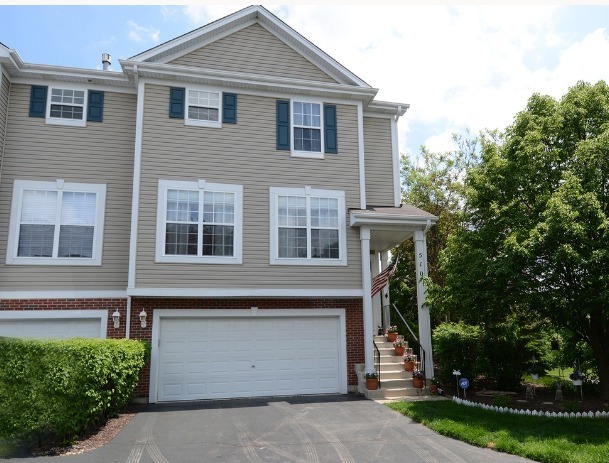 a front view of a house with a garage