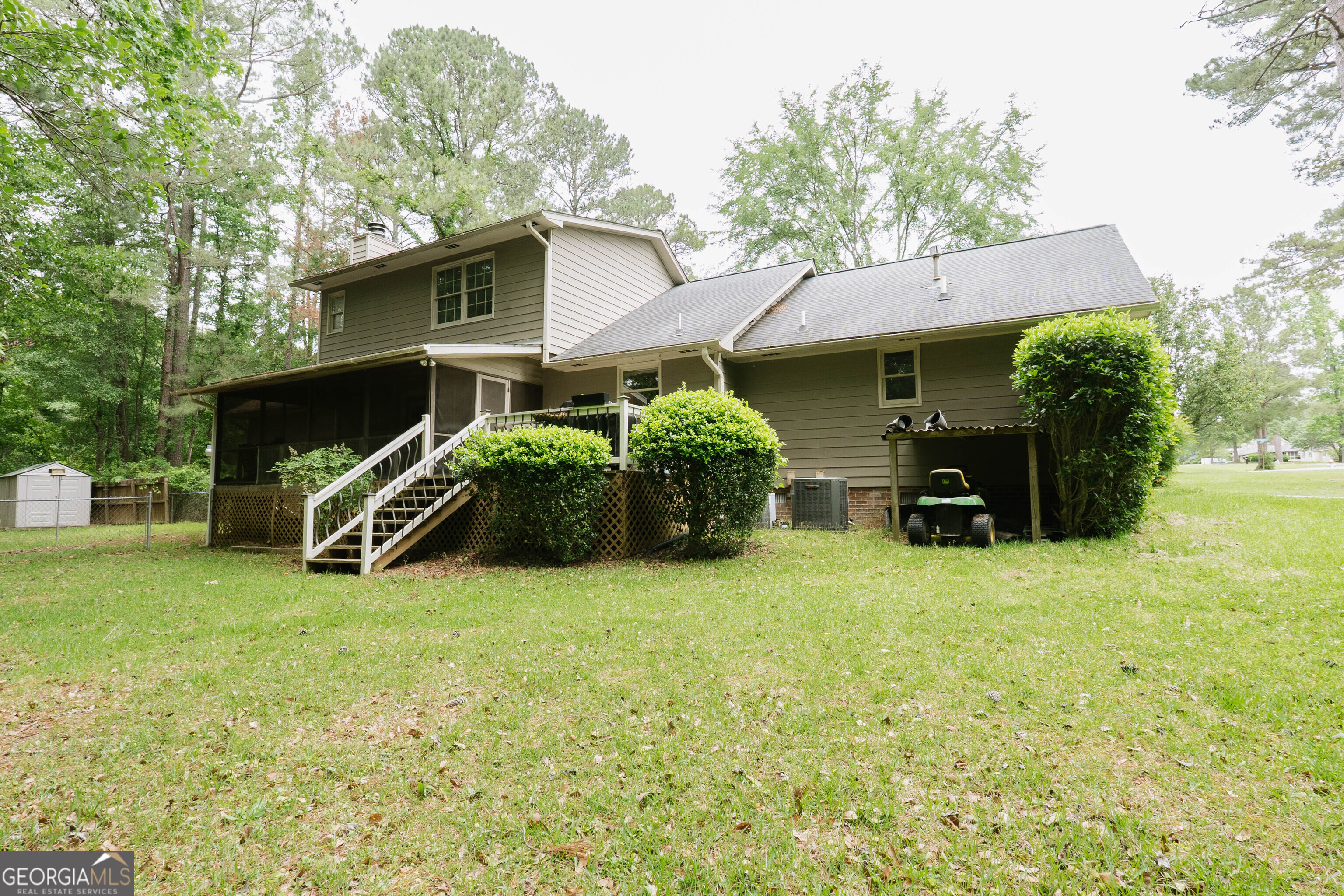 139 Cords Bridge Road Northeast Milledgeville, GA 31061 - Photo 30 of 35 a yellow house sitting in middle of the yard