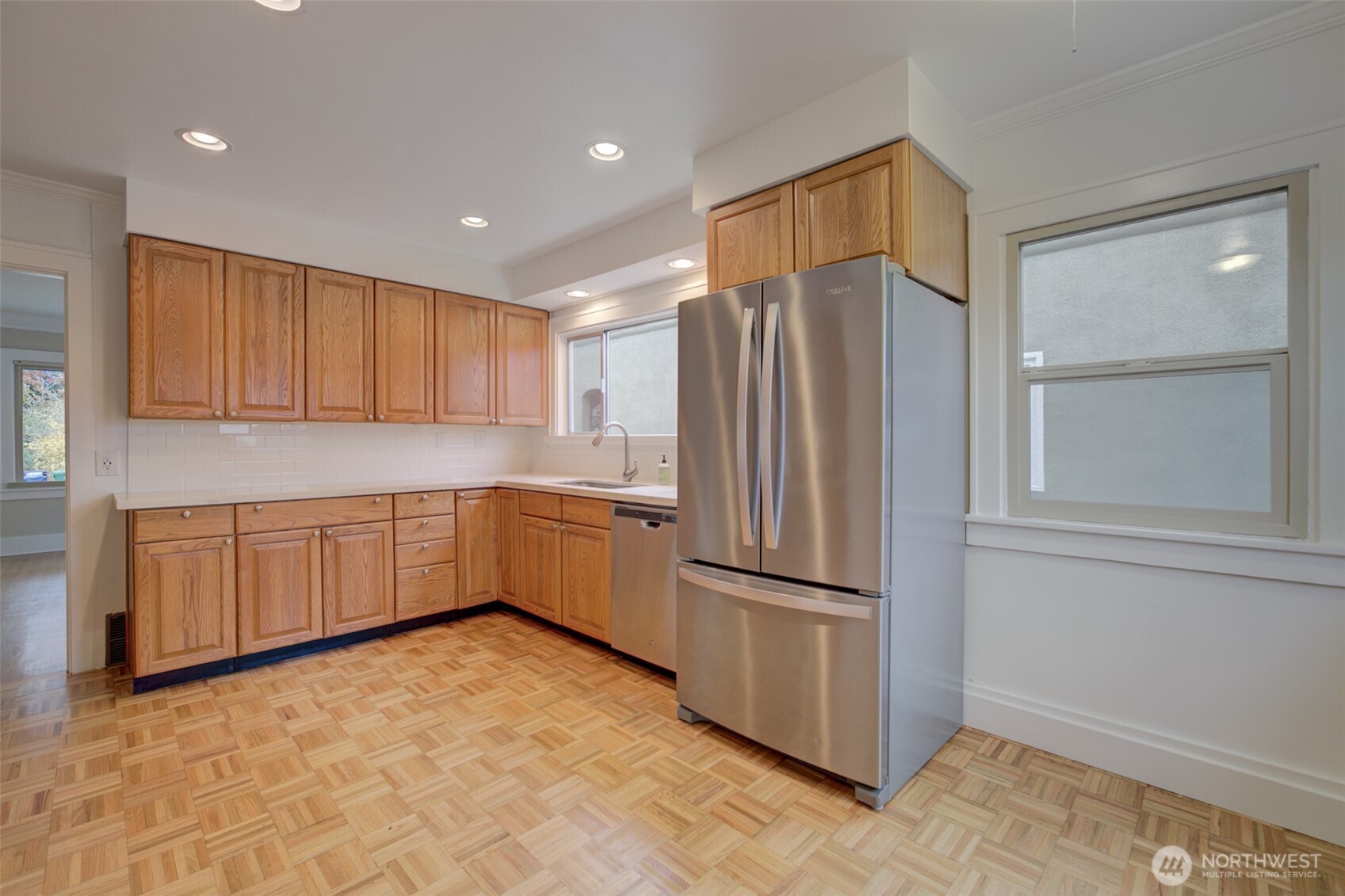 357 29th Avenue Seattle, WA 98122 - Photo 11 of 31 a kitchen with stainless steel appliances a refrigerator and microwave