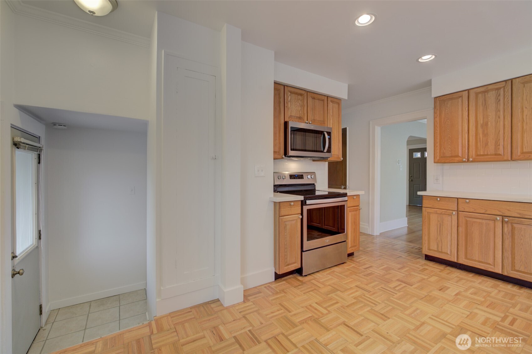 357 29th Avenue Seattle, WA 98122 - Photo 12 of 31 a kitchen with sink cabinets and stainless steel appliances