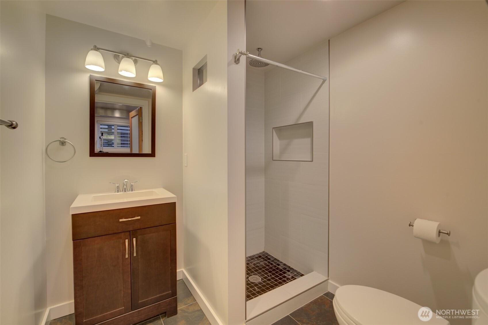 357 29th Avenue Seattle, WA 98122 - Photo 15 of 31 a bathroom with a toilet a sink and mirror