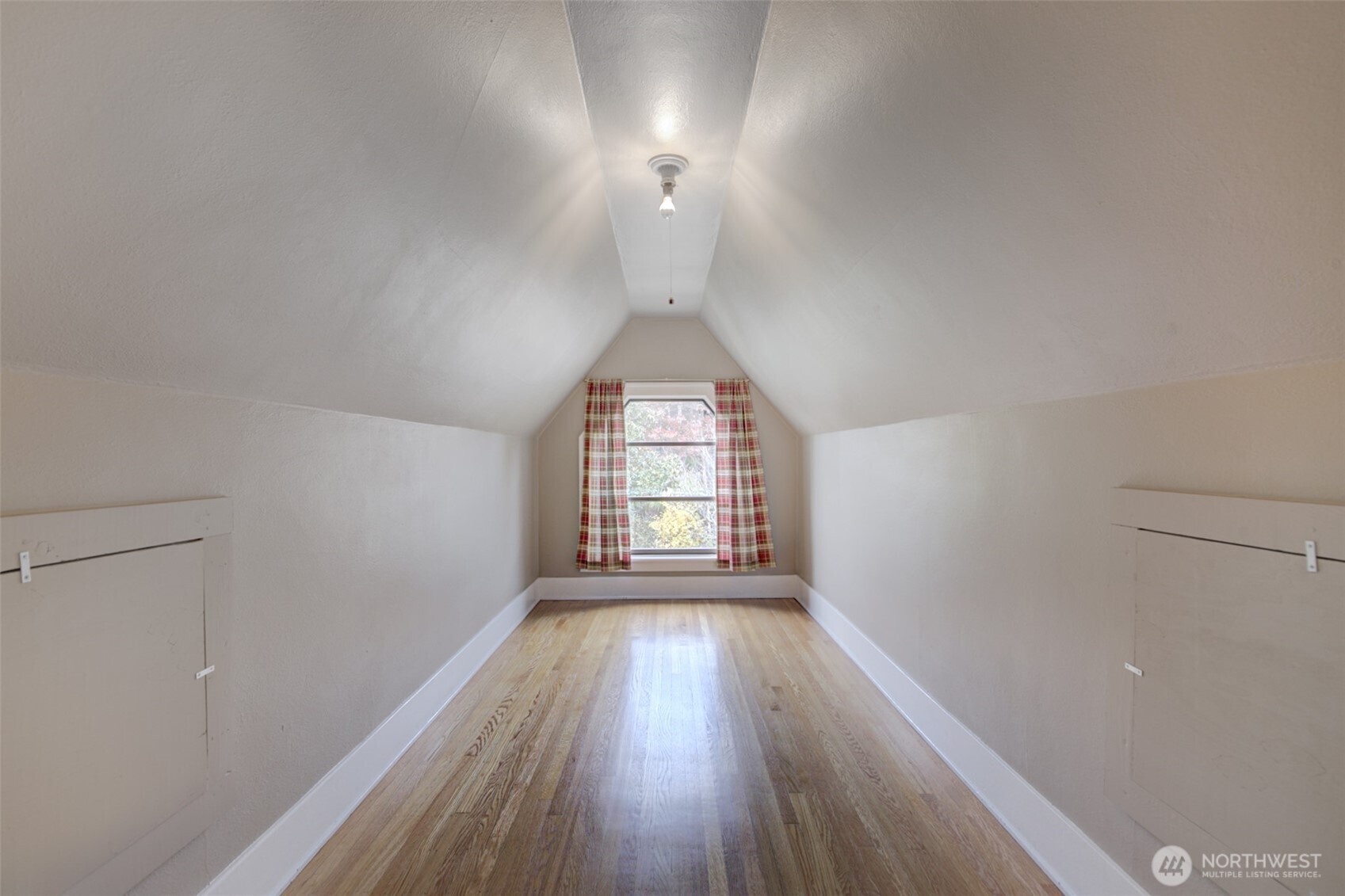 357 29th Avenue Seattle, WA 98122 - Photo 24 of 31 wooden floor in an empty room with a window