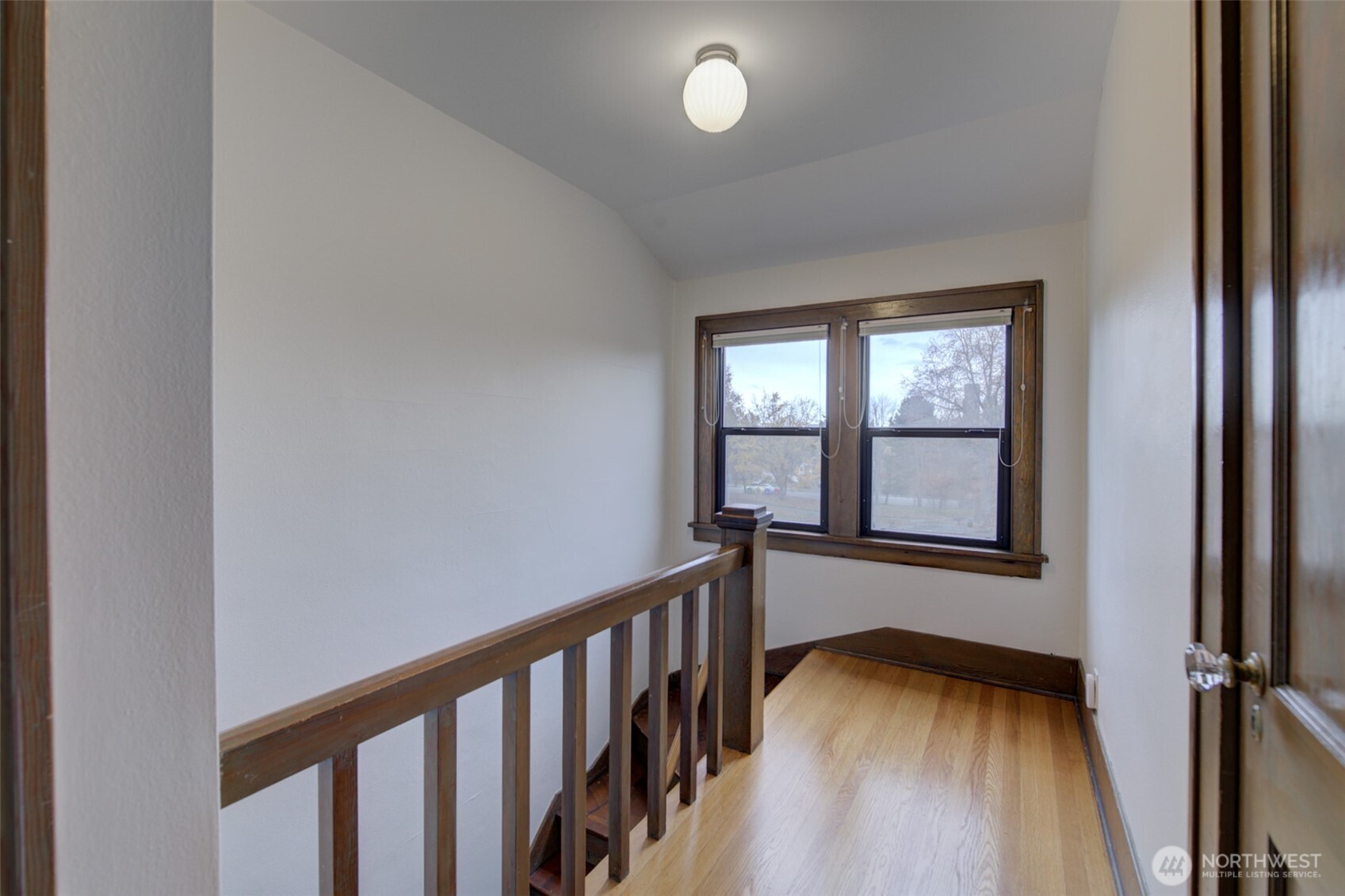 357 29th Avenue Seattle, WA 98122 - Photo 25 of 31 a view of a hallway with wooden floor and staircase