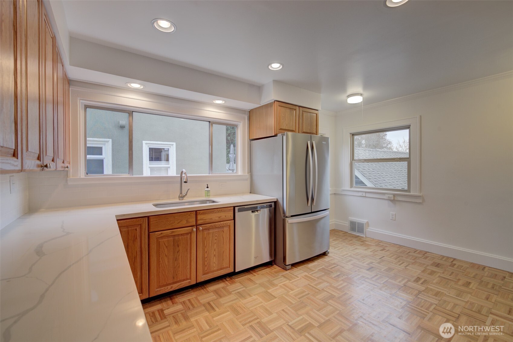 357 29th Avenue Seattle, WA 98122 - Photo 10 of 31 a large bathroom with a double vanity sink a mirror and a bathtub