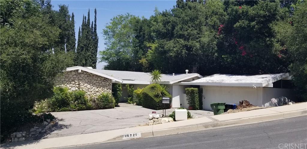 15721 Royal Ridge Road Sherman Oaks, CA 91403 - Photo 1 of 1 a view of a house with a yard and large tree