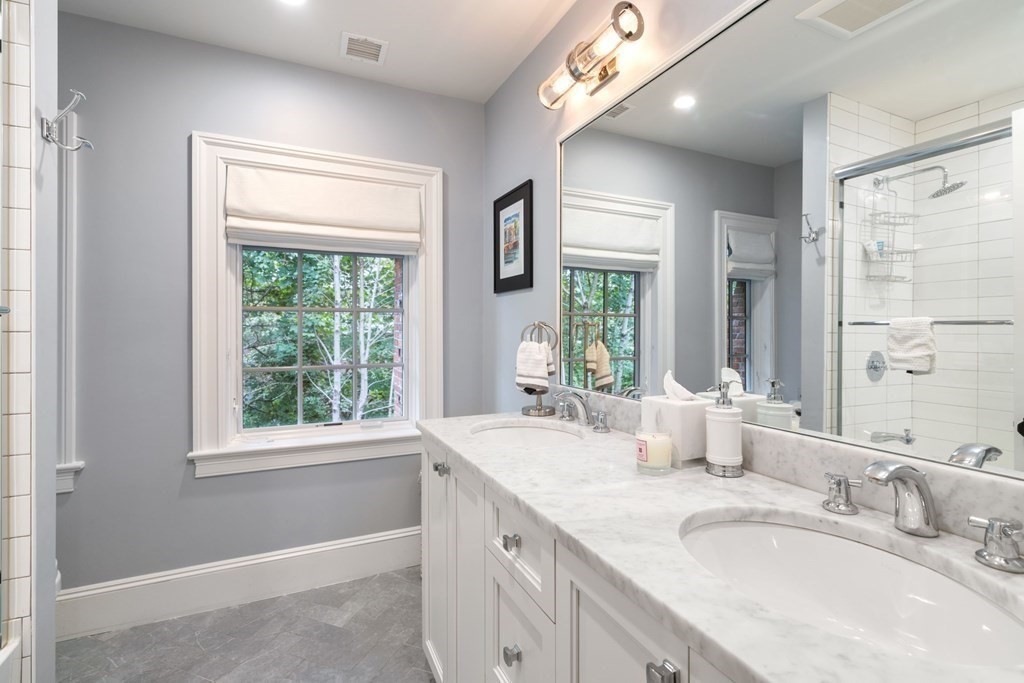 52 Hammondswood Road Newton, MA 02467 - Photo 24 of 34 a bathroom with a granite countertop sink and a window