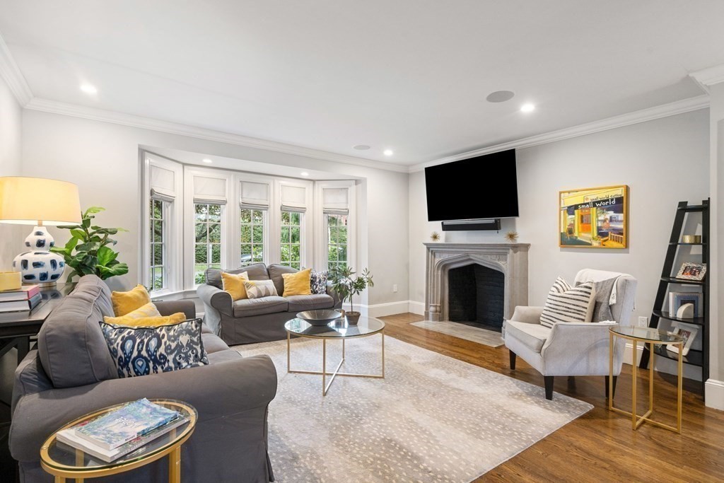 52 Hammondswood Road Newton, MA 02467 - Photo 3 of 34 a living room with furniture a fireplace and a flat screen tv