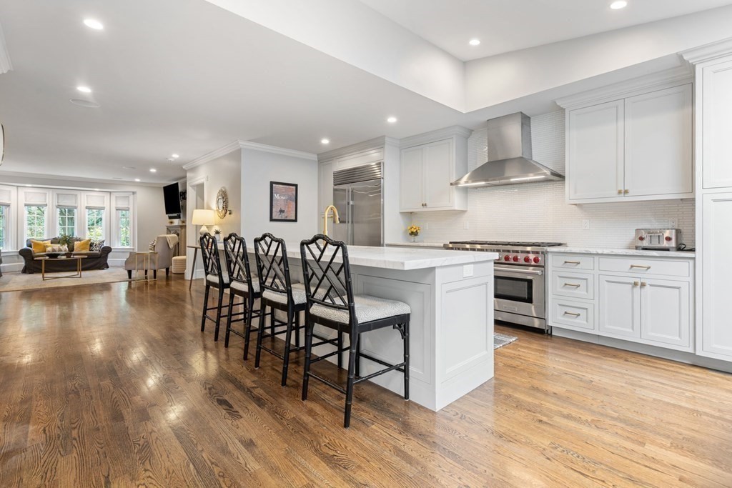 52 Hammondswood Road Newton, MA 02467 - Photo 4 of 34 a kitchen with stainless steel appliances a table and chairs in it