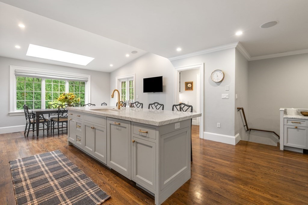 52 Hammondswood Road Newton, MA 02467 - Photo 6 of 34 a bathroom with a double vanity sink a mirror and a bathtub