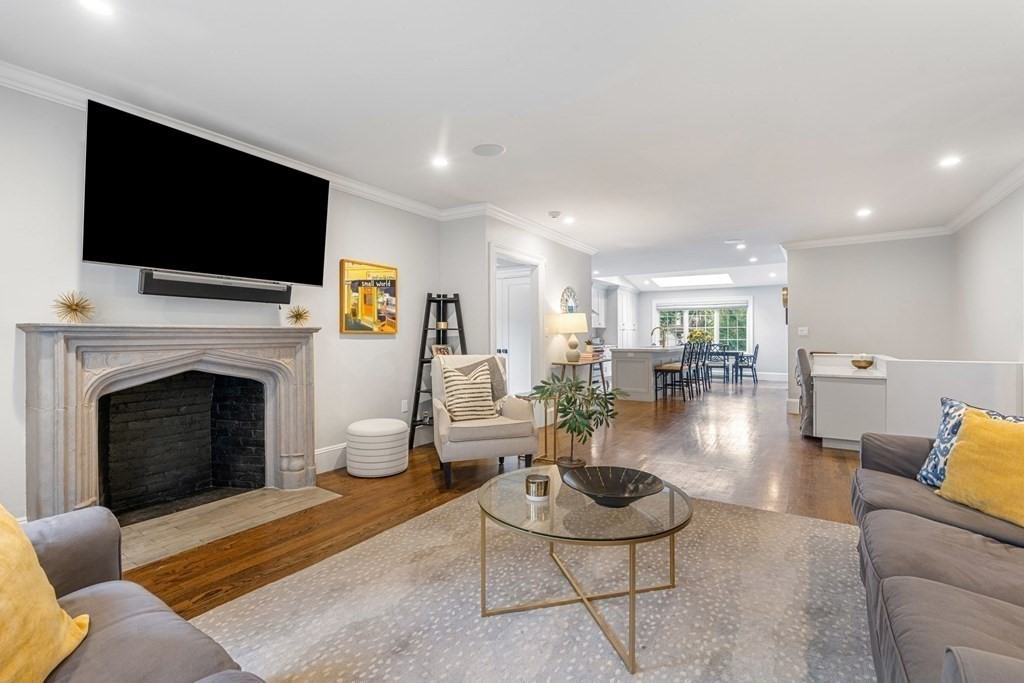 52 Hammondswood Road Newton, MA 02467 - Photo 8 of 34 a living room with furniture a flat screen tv and a fireplace