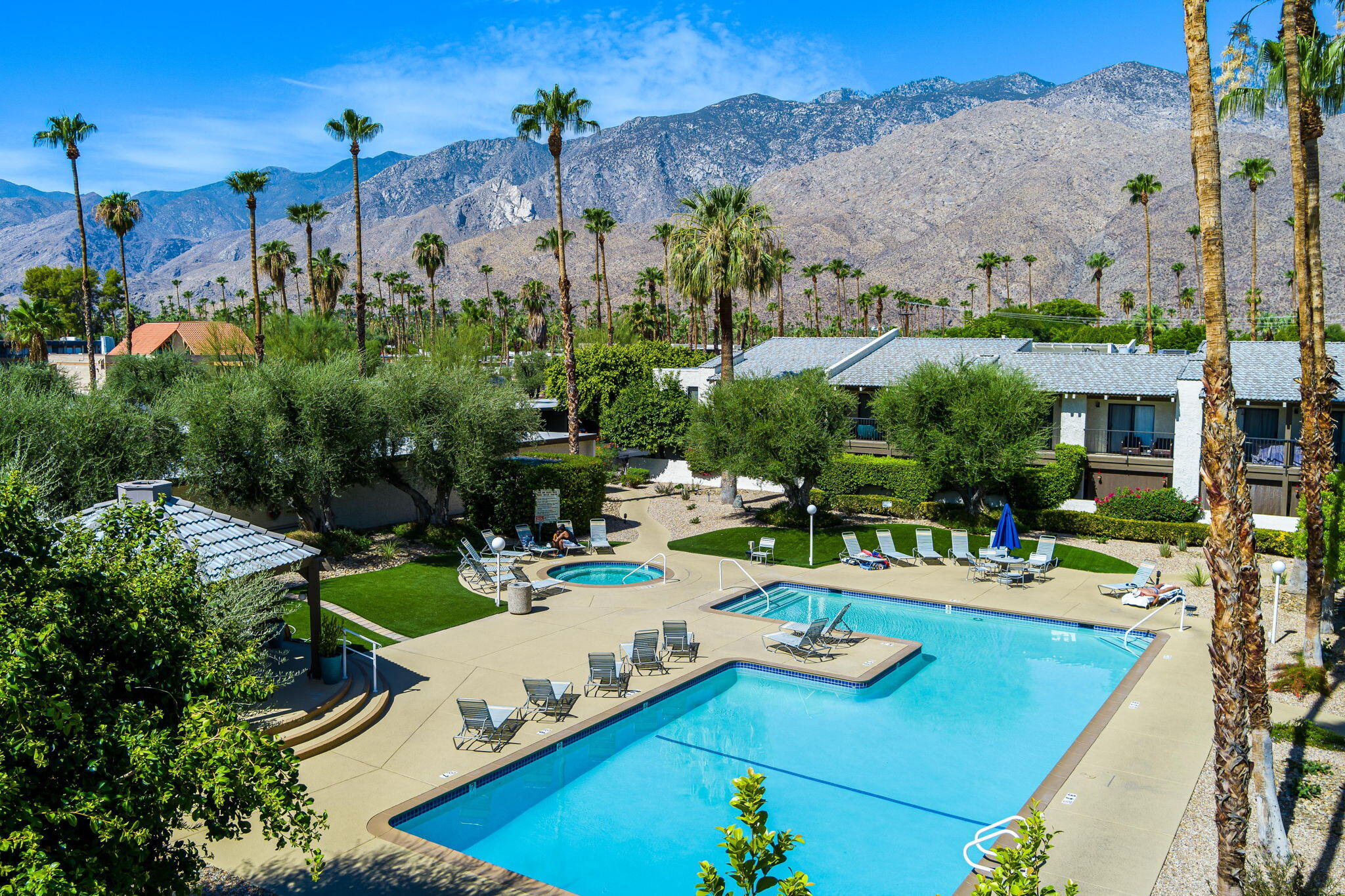 1150 East Palm Canyon Drive, Unit 37 Palm Springs, CA 92264 - Photo 2 of 40 an aerial view of a house with swimming pool patio and outdoor seating