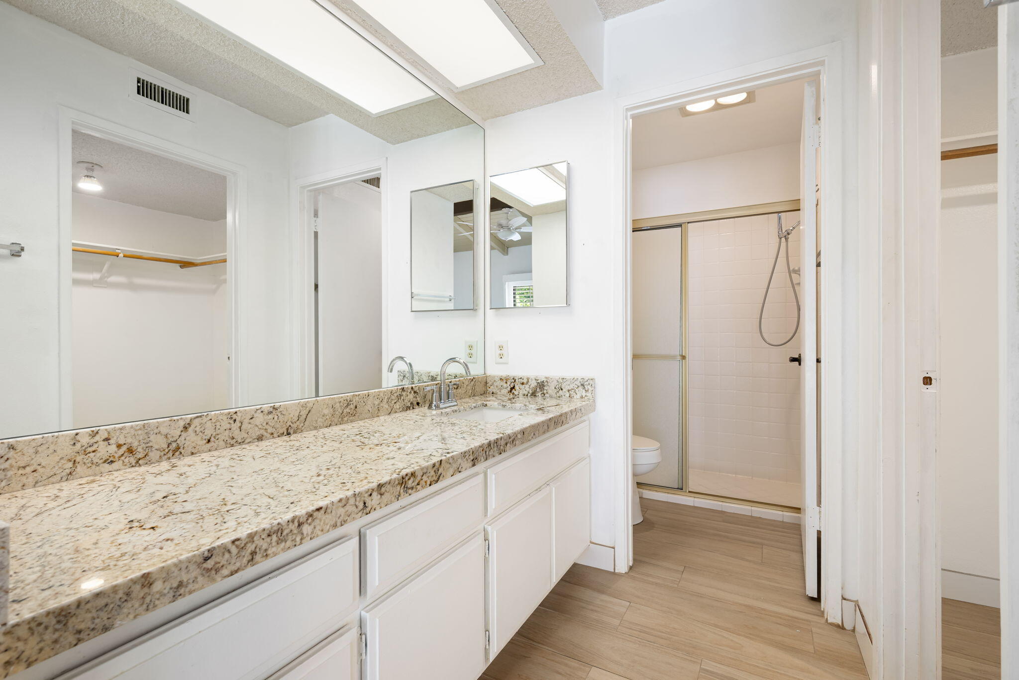 1150 East Palm Canyon Drive, Unit 37 Palm Springs, CA 92264 - Photo 27 of 40 a bathroom with a granite countertop sink and a mirror