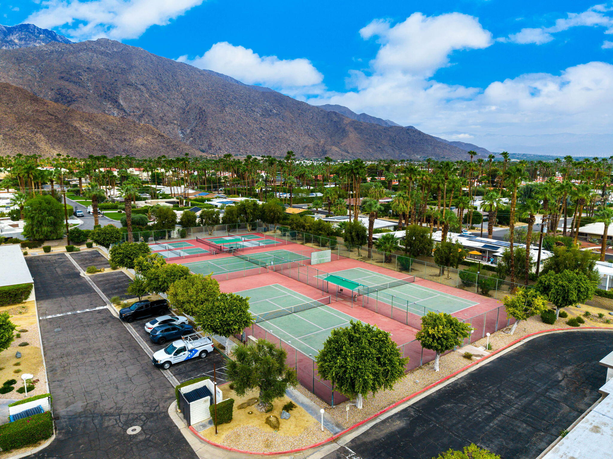 1150 East Palm Canyon Drive, Unit 37 Palm Springs, CA 92264 - Photo 35 of 40 a view of a swimming pool with a yard