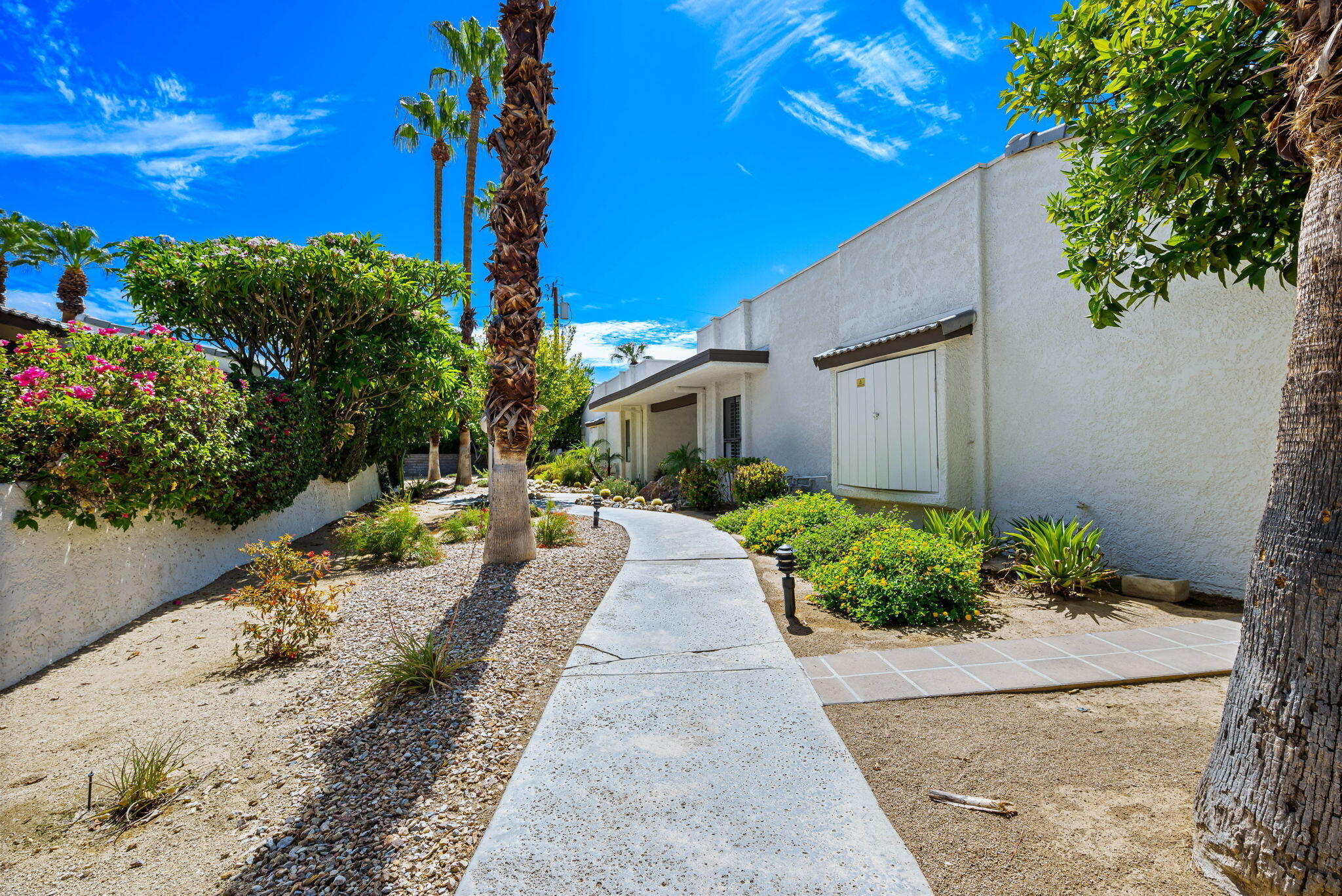 1150 East Palm Canyon Drive, Unit 37 Palm Springs, CA 92264 - Photo 5 of 40 a view of a backyard with potted plants