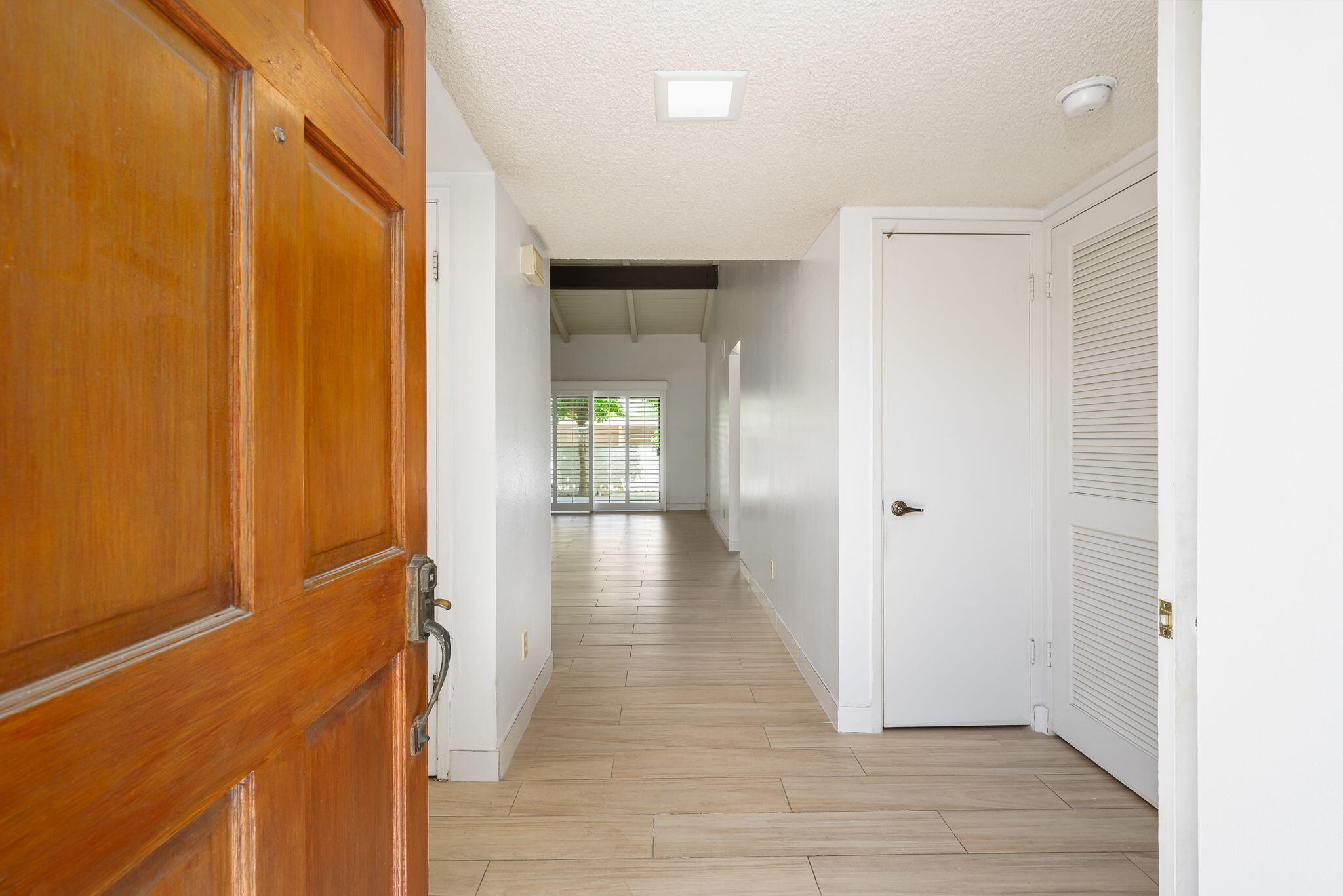 1150 East Palm Canyon Drive, Unit 37 Palm Springs, CA 92264 - Photo 7 of 40 a view of a hallway with wooden floor