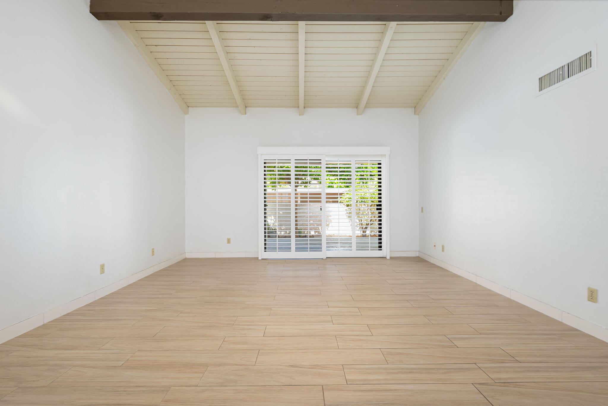 1150 East Palm Canyon Drive, Unit 37 Palm Springs, CA 92264 - Photo 9 of 40 a view of an empty room with a window