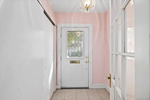 a view of entryway with chandelier