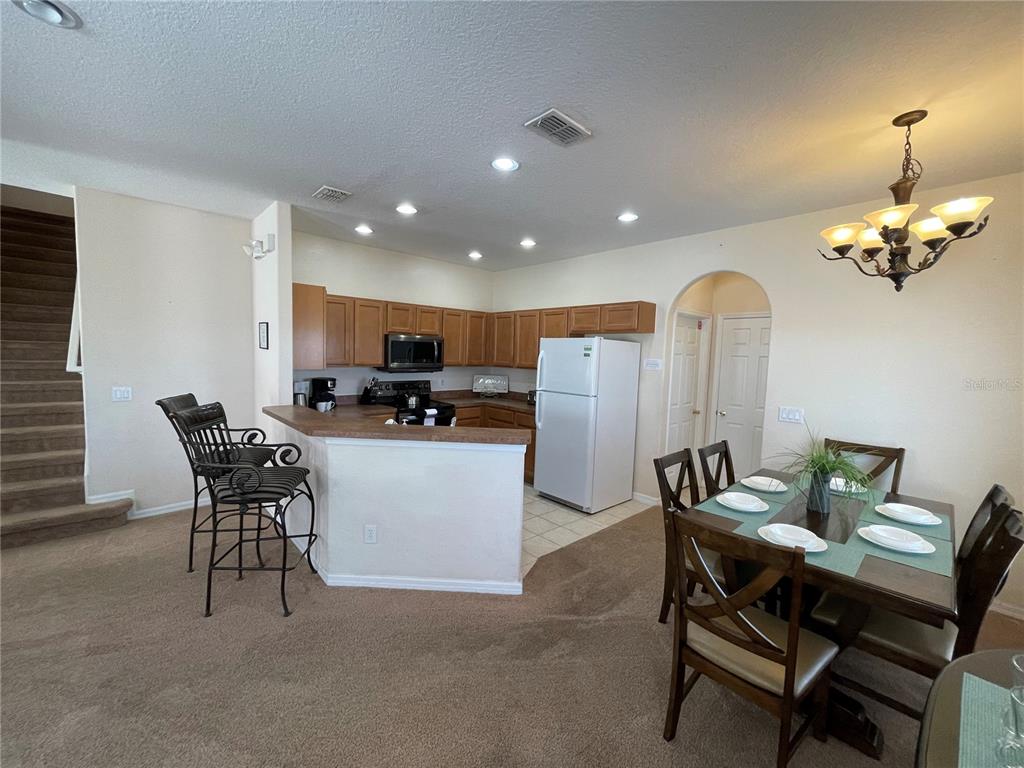 141 Summer Pl Loop Clermont, FL 34714 - Photo 14 of 63 a view of a dining room with furniture