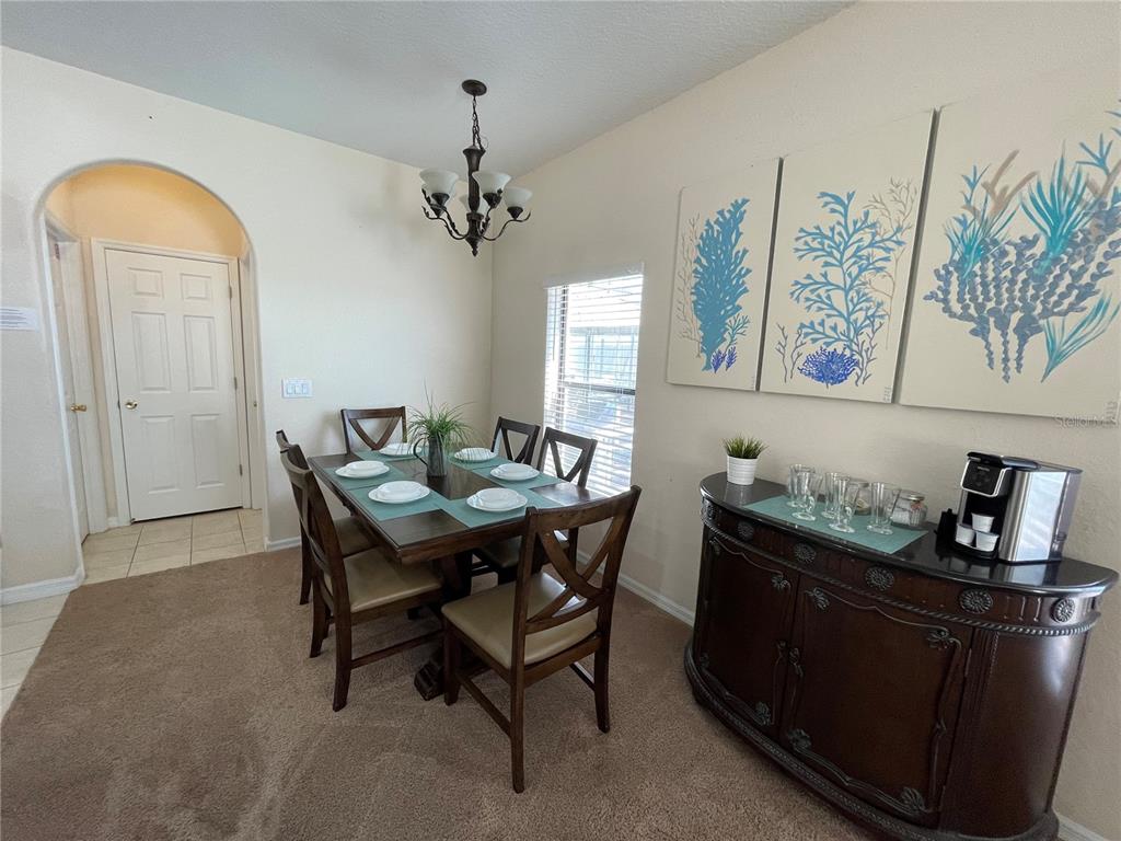 141 Summer Pl Loop Clermont, FL 34714 - Photo 17 of 63 a dining room with a table and chairs