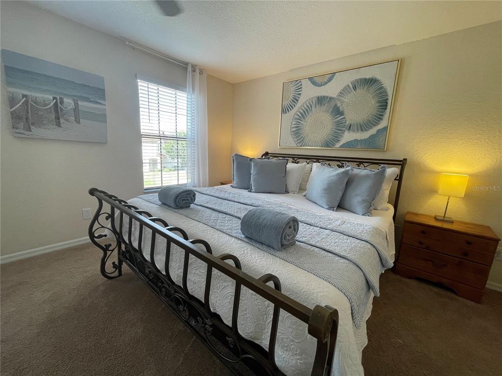 141 Summer Pl Loop Clermont, FL 34714 - Photo 25 of 63 a bedroom with a bed and a window