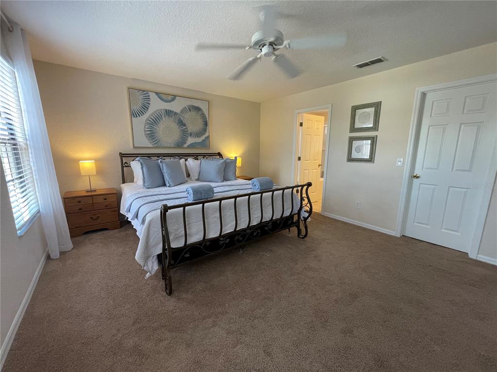 141 Summer Pl Loop Clermont, FL 34714 - Photo 26 of 63 a bed room with a bed and a window