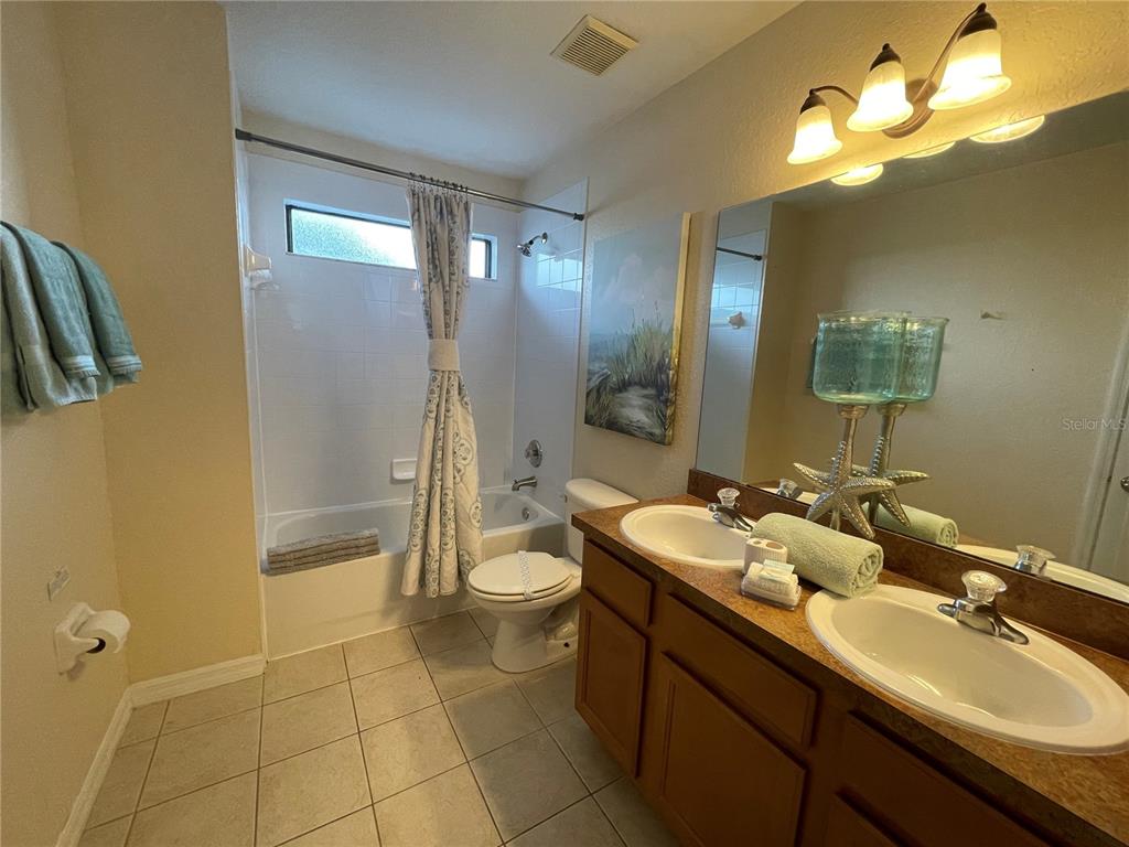 141 Summer Pl Loop Clermont, FL 34714 - Photo 33 of 63 a bathroom with a sink a toilet and shower