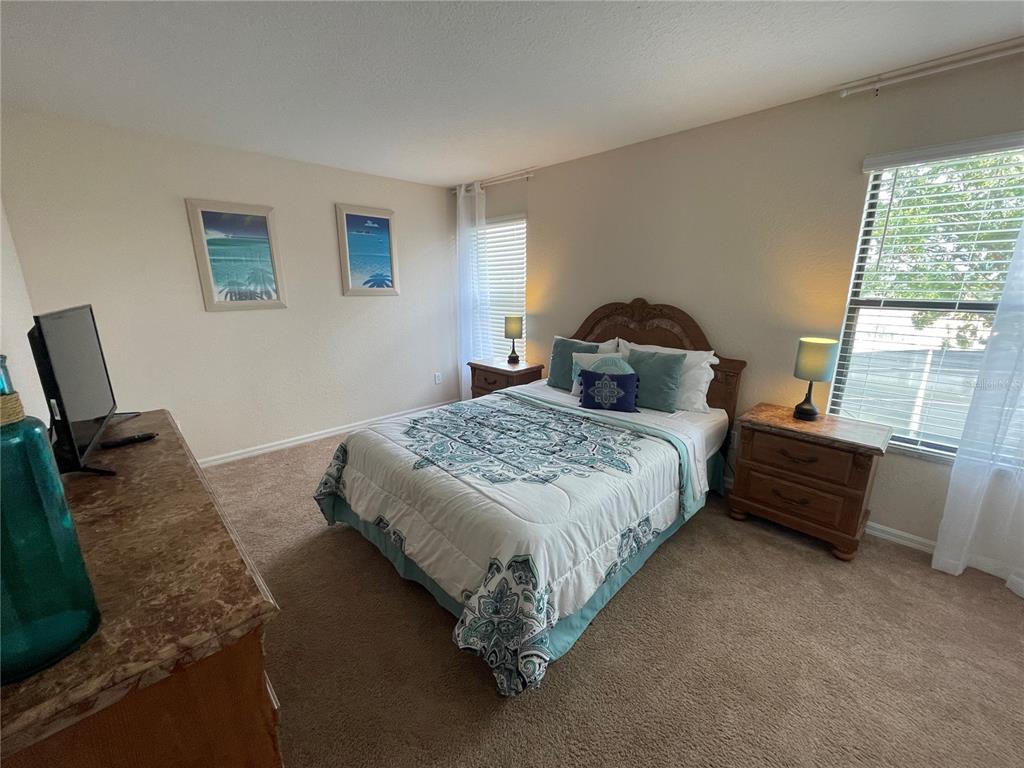 141 Summer Pl Loop Clermont, FL 34714 - Photo 36 of 63 a bedroom with a bed and window