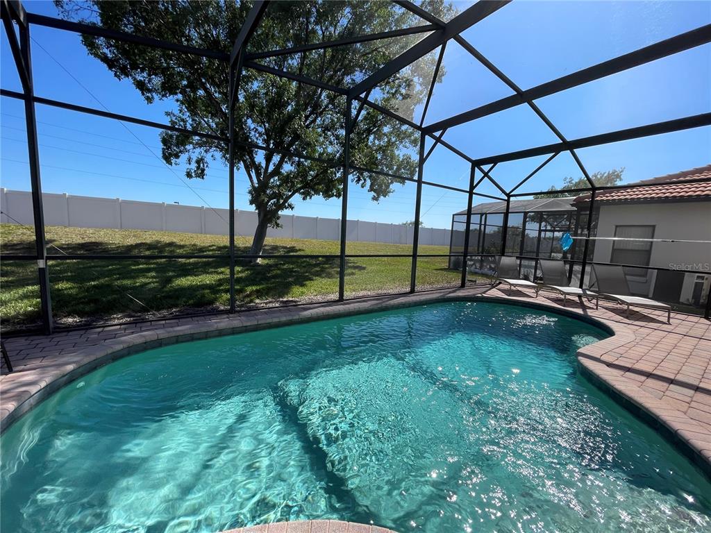 141 Summer Pl Loop Clermont, FL 34714 - Photo 44 of 63 a view of a backyard with sitting area