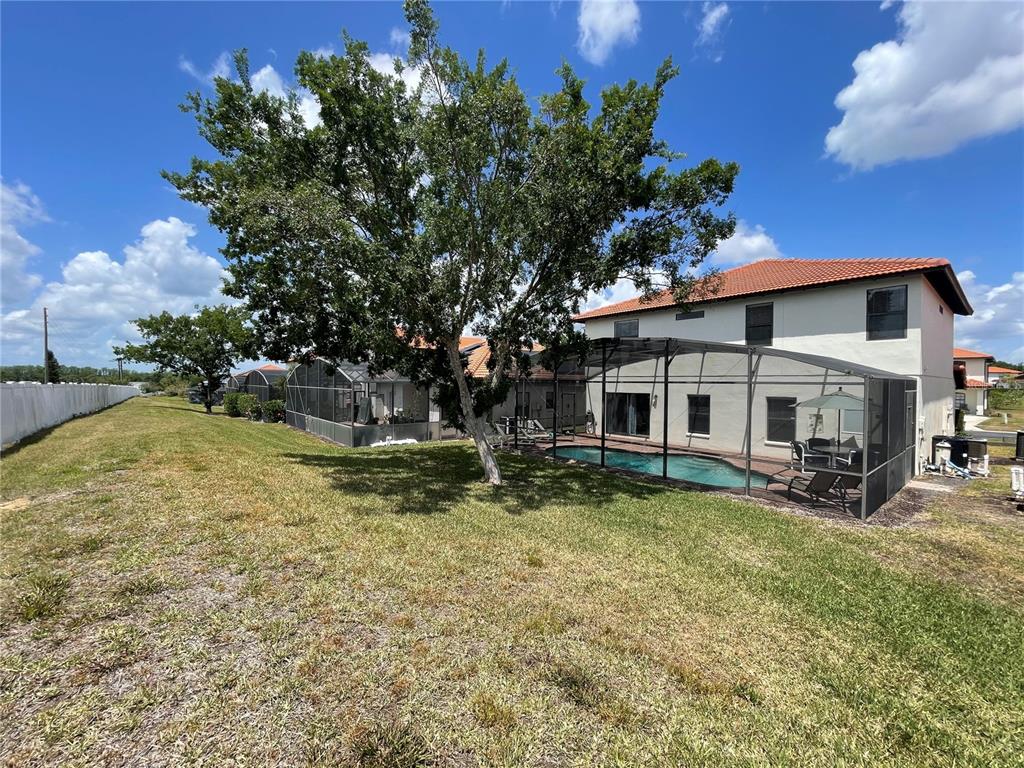 141 Summer Pl Loop Clermont, FL 34714 - Photo 48 of 63 a view of a house with a yard porch and sitting area