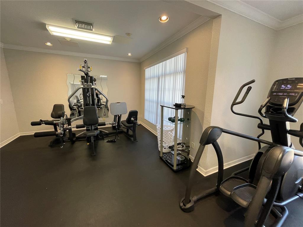 141 Summer Pl Loop Clermont, FL 34714 - Photo 54 of 63 a view of a room with gym equipment
