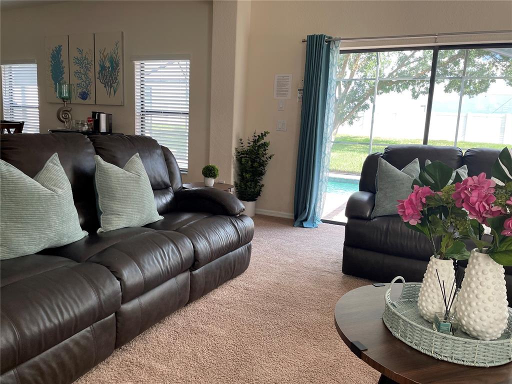 141 Summer Pl Loop Clermont, FL 34714 - Photo 8 of 63 a living room with furniture and a large window