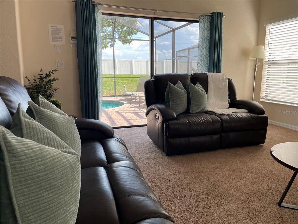 141 Summer Pl Loop Clermont, FL 34714 - Photo 10 of 63 a living room with furniture and a large window