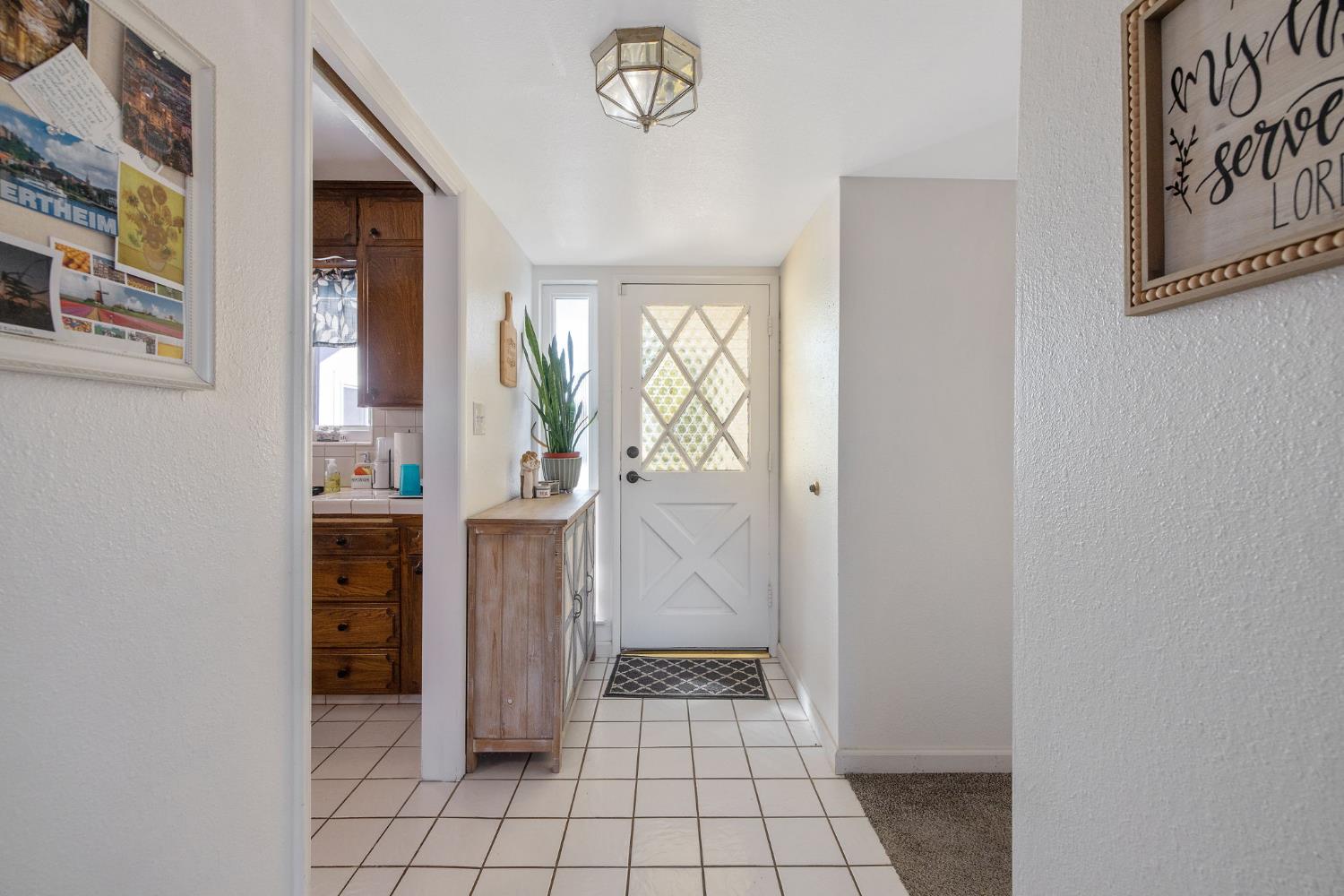 1310 East Sample Avenue Fresno, CA 93710 - Photo 4 of 30 a view of an entryway with wooden floor