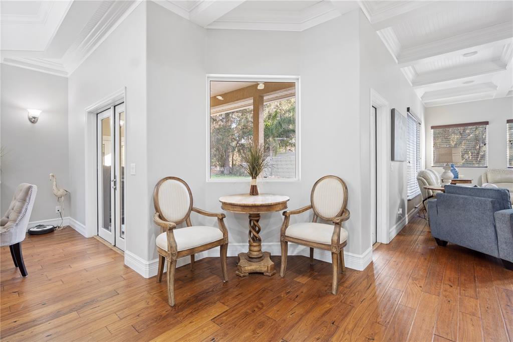 3108 Carter Jones Road Groveland, FL 34736 - Photo 12 of 54 a living room with furniture a table and wooden floor