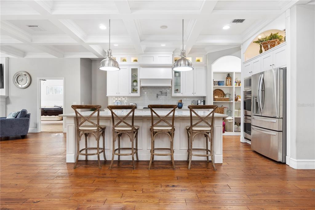 3108 Carter Jones Road Groveland, FL 34736 - Photo 14 of 54 a large kitchen with a table and chairs