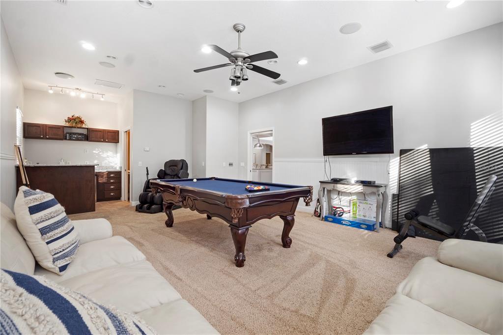3108 Carter Jones Road Groveland, FL 34736 - Photo 22 of 54 a living room with furniture and a flat screen tv