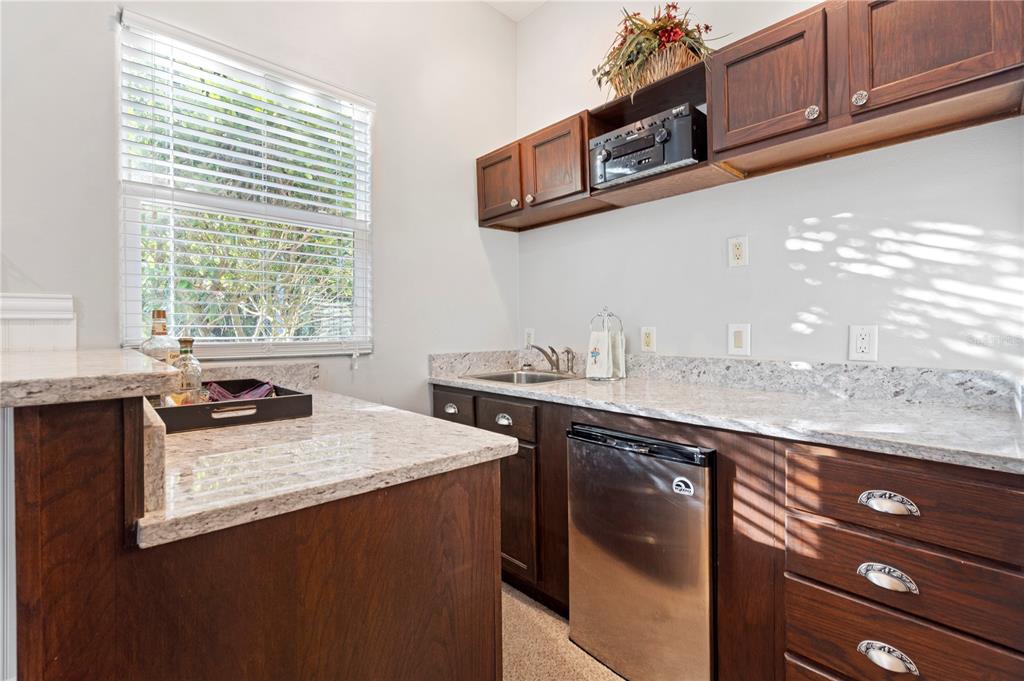3108 Carter Jones Road Groveland, FL 34736 - Photo 23 of 54 a kitchen with stainless steel appliances granite countertop a sink stove and cabinets
