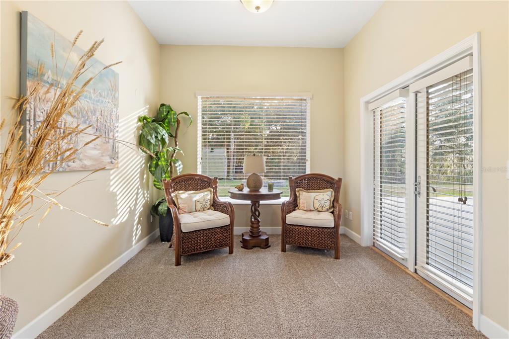 3108 Carter Jones Road Groveland, FL 34736 - Photo 33 of 54 a living room with furniture and a large window