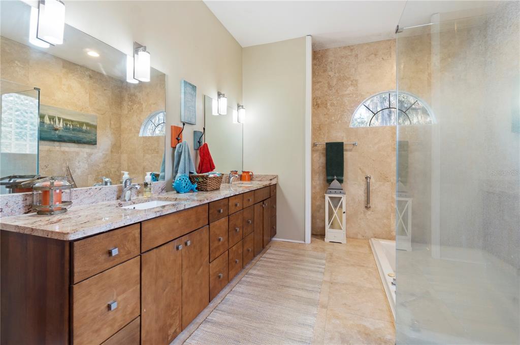 3108 Carter Jones Road Groveland, FL 34736 - Photo 37 of 54 a bathroom with a double vanity sink and a mirror