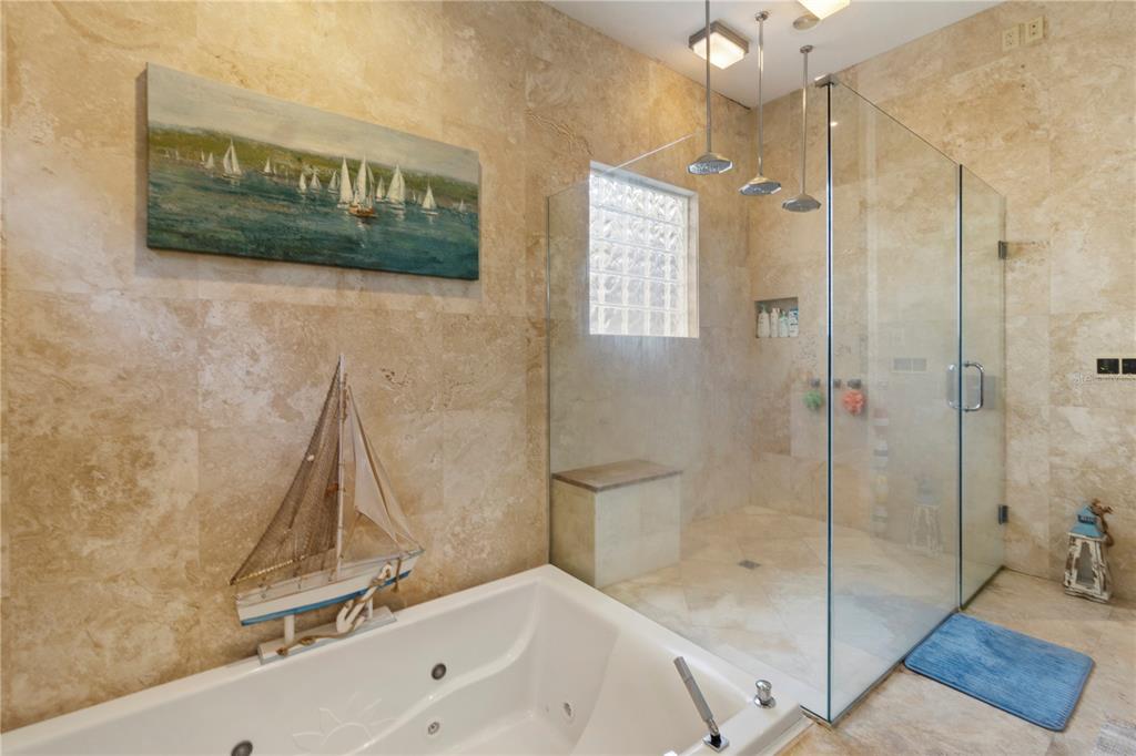 3108 Carter Jones Road Groveland, FL 34736 - Photo 38 of 54 a bathroom with a bathtub and a shower