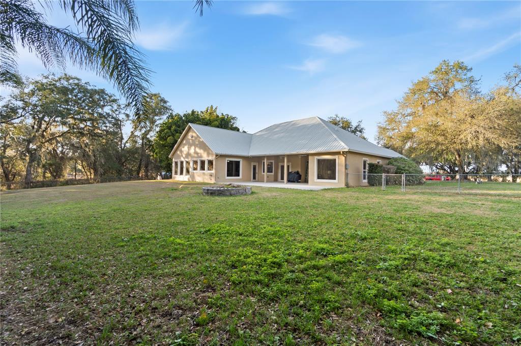 3108 Carter Jones Road Groveland, FL 34736 - Photo 41 of 54 a front view of a house with garden