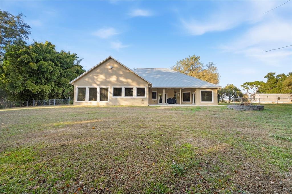 3108 Carter Jones Road Groveland, FL 34736 - Photo 42 of 54 a front view of a house with a garden