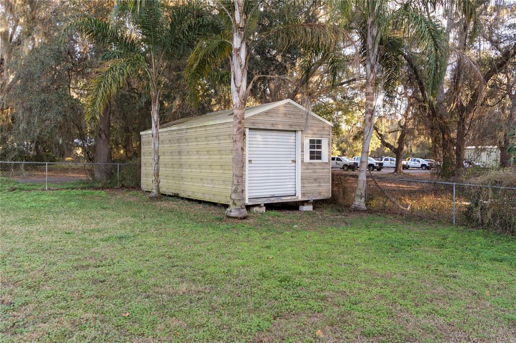 3108 Carter Jones Road Groveland, FL 34736 - Photo 44 of 54 a view of a house with a yard