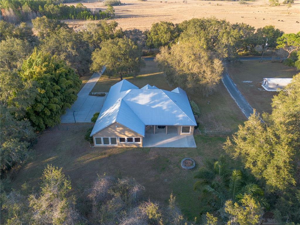 3108 Carter Jones Road Groveland, FL 34736 - Photo 49 of 54 an aerial view of a house with a lake view