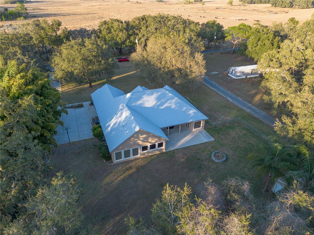 3108 Carter Jones Road Groveland, FL 34736 - Photo 50 of 54 an aerial view of a house with a yard