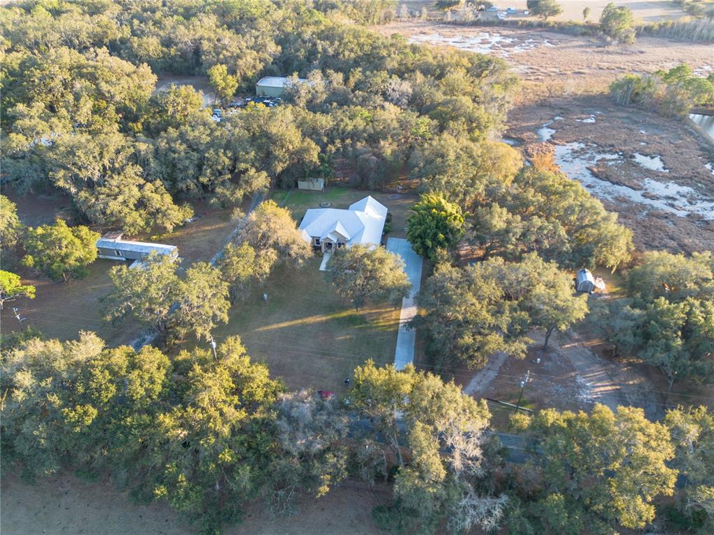 3108 Carter Jones Road Groveland, FL 34736 - Photo 52 of 54 a view of a lake with a yard