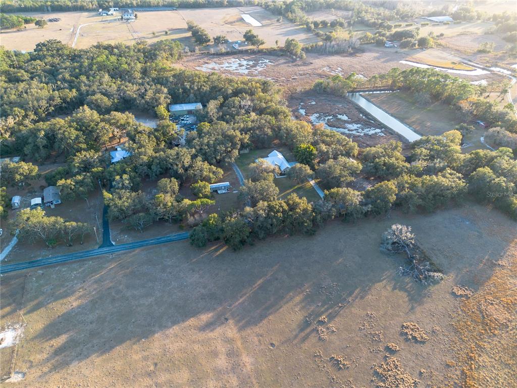 3108 Carter Jones Road Groveland, FL 34736 - Photo 53 of 54 a view of a dry yard with wooden fence