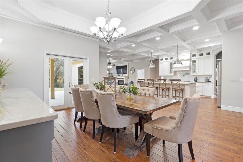 3108 Carter Jones Road Groveland, FL 34736 - Photo 8 of 54 a view of a dining room with furniture and wooden floor